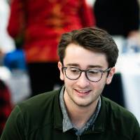 A student sitting at a table.